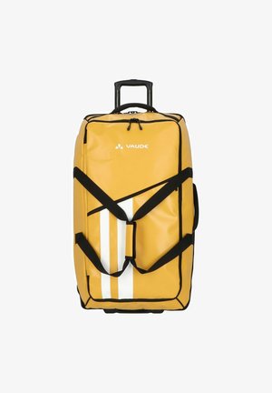 Sac de voyage à roulettes jaune avec des sangles noires, des rayures blanches et le logo VAUDE. Il dispose d'une poignée rétractable et d'un compartiment principal zippé.