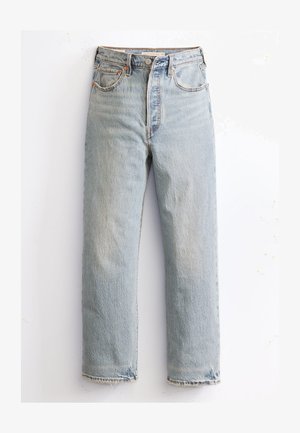 Jean en denim bleu clair avec une coupe droite, taille haute et texture décolorée. Comprend des coutures contrastées, cinq poches et un ourlet brut.