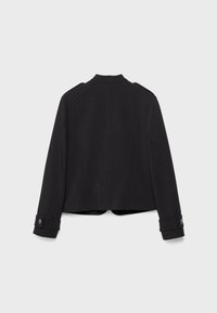 Veste noire à manches longues avec poignets boutonnés et épaulettes, vue de dos sur fond blanc.