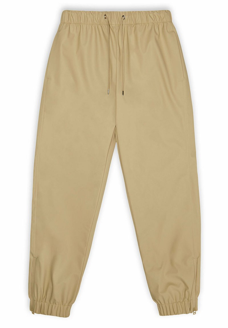 Beige joggingbroek van soepel materiaal, met een elastische tailleband met trekkoord, zijzakken en elastische boorden bij de enkels.