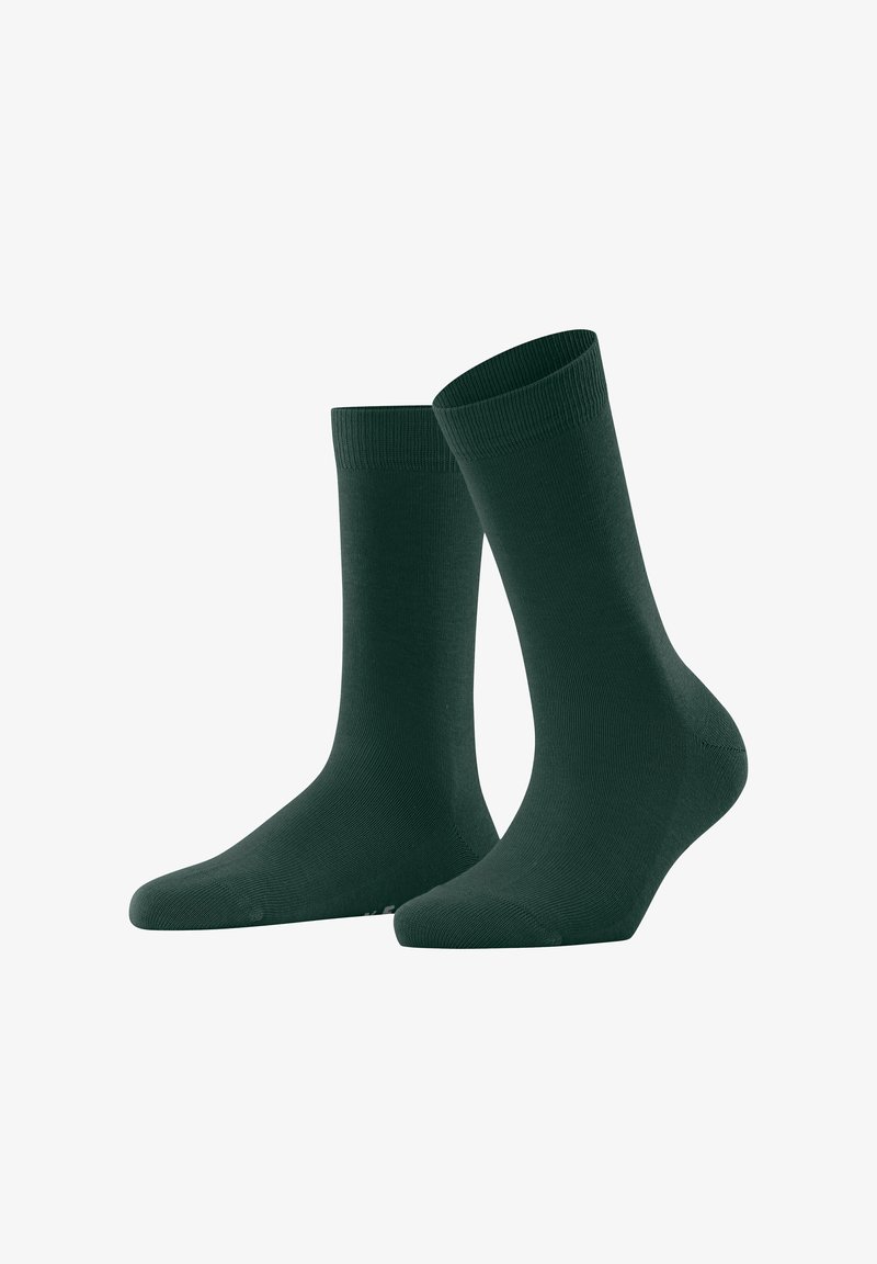 Ein Paar dunkelgrüne Socken bis zur Mitte der Wade mit gerippten Bündchen, auf einem weißen Hintergrund abgebildet, wobei eine Socke leicht nach vorne geneigt steht.