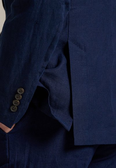 Navy blue linen suit jacket featuring a vented design and four dark buttons on the cuff, showcasing a textured finish.