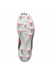 Suola di scarpa da calcetto, prevalentemente bianca con pois neri, dotata di borchie rosa e turchesi, design testurizzato per una migliore trazione.
