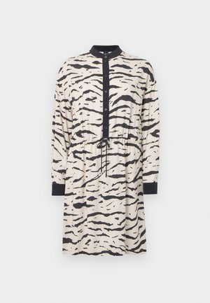 Long-sleeve dress in beige with black tiger stripes, featuring a collared neckline, button-down front, and adjustable drawstring waist.