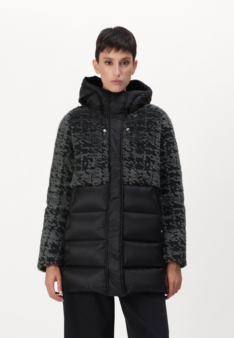 Padded jacket with a black and gray patterned upper, smooth black lower section, adjustable hood, and two front pockets.