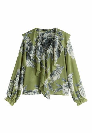 Zöld virágos blúz fodros elülső résszel, hossz ú, puffos ujjakkal és nyakán kötővel. Könnyű, sima tapintású anyagból készült.
