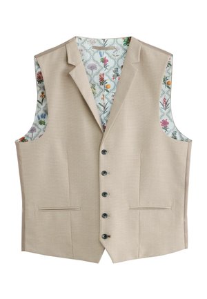 Gilet beige su misura con un'esterno testurizzato, dotato di una fodera con motivo floreale e bottoni neri, e due tasche frontali.