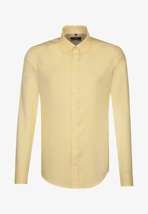 Chemise jaune à manches longues avec col à boutons et boutons blancs, présentée sur fond blanc.
