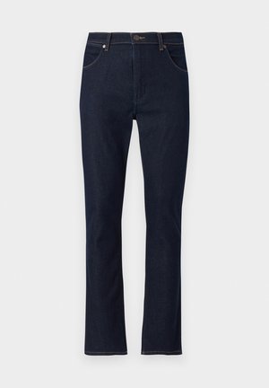 Tmavomodré rifle s rovnými nohavicami, prednými vreckami, pútkami na opasok a zapínaním na gombík.