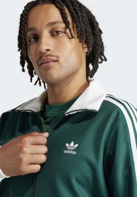 adidas Originals Majica s kapuljačom i patentnim zatvaračem - collegiate green