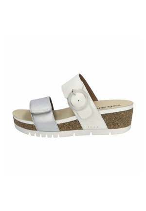 Vit och silver skidsandal med korkklack, justerbar rem med en rund spänne och texturerad innersula.