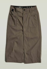 Gonna midi khaki realizzata in un tessuto misto cotone, con due tasche frontali, uno spacco centrale e una vita nera con dettagli del logo.