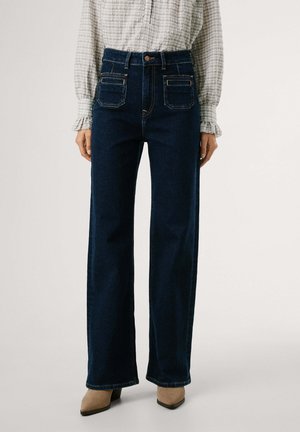 Hoge taille donkerblauwe jeans met wijde pijpen, voorzien van voorzakken en een knoopsluiting. Glad denim met zichtbare stiksels.