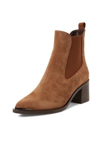 Braune Wildleder-Stiefelette mit spitzer Zehenpartie, elastischen Seitenpaneelen und einem stabilen Absatz. Hat eine glatte Textur und minimale Nähdetails.