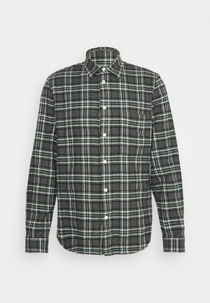 Grøn og sort ternet flannel skjorte med lange ærmer, knap-ned krave og en brystlomme. Har hvide knapper og et struktureret stof.
