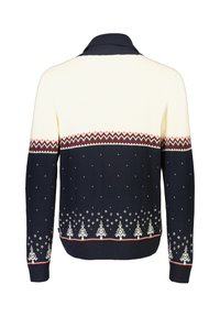 Stickad tröja i kräm och marinblå med krage, med ett zigzagmönster, snöflingor och träd längs fållen i vita och röda accenter.