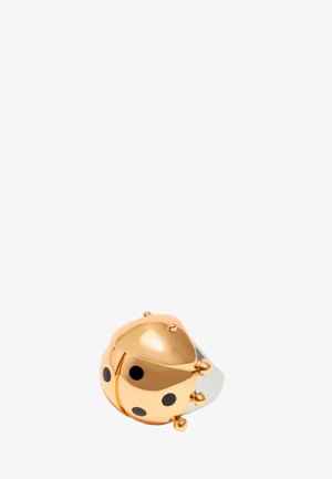 Gold and silver ladybug-shaped ring with black polka dots, smooth metallic texture, rounded design, and small metallic accents.