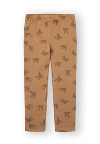 Leggings color marrón hechos de tela suave, con un patrón negro de aves repetido, y una cintura elástica para mayor comodidad.