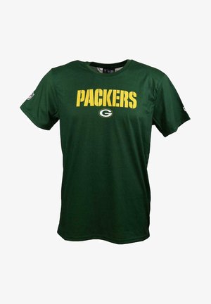 Grünes T-Shirt mit kurzen Ärmeln aus Baumwolle. Mit "PACKERS" in Gelb über der Brust und einem Teamlogo darunter. Schlichtes Design.