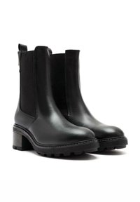Black leather ankle boots with elastic side panels, chunky heel, textured sole, and smooth finish; sleek, modern design.