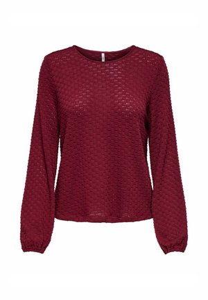 Top burdeos de manga larga con un patrón texturizado y puños elásticos. Cuello redondo y ajuste relajado, hecho de un material ligero.