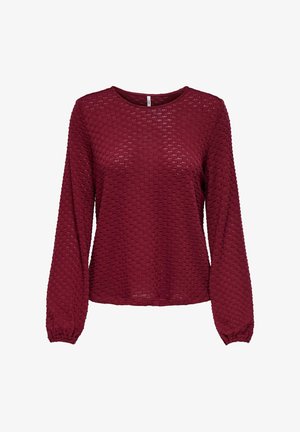 Burgundia pikkade varrukatega särk, millel on tekstuuriline muster ja elastsed mansetid. Ümar kaelus ja lõdva istuvusega, valmistatud kergest materjalist.