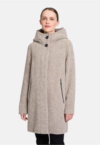 Beige wollen blend jas met een capuchon, twee voorzakken en zwarte ritsaccenten. Heeft een rechte snit en een gestructureerde stof.