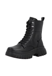 Bottine à lacets en cuir noir avec une semelle épaisse et rainurée et des lacets noirs. Comprend des œillets en métal et une languette à l'arrière.