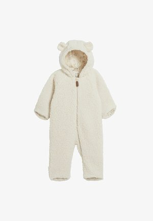 Weißer Fleece-Overall mit einer strukturierten, flauschigen Oberfläche, einem Reißverschluss vorne und einer Kapuze mit Bärenohren. Der Innenfutter hat ein gemustertes Design.