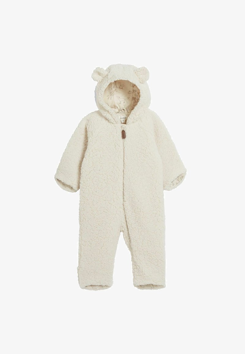 Hvid fleece heldragt med en tekstureret, fluffy overflade, en frontlynlås og en hætte med bjørneører. Indersiden har et mønsterdesign.