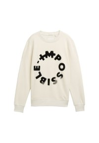 Sudadera hecha de suave tela color crema con un motivo circular que presenta letras negras que deletrean "IMPOSIBLE" en diferentes fuentes y tamaños.