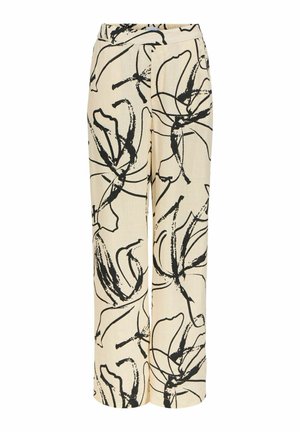 Pantalon large couleur crème avec des motifs floraux abstraits en lignes noires et une taille haute.