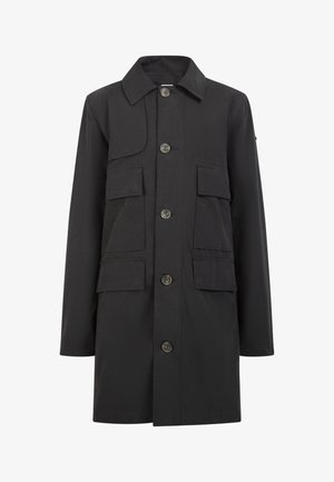 Jachetă neagră cu închidere prin nasturi în față, două buzunare pe piept și guler. Fabricată dintr-un material rezistent, cu o textură netedă.