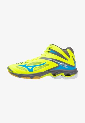 Zapatilla deportiva de caña alta de color amarillo brillante con detalles en azul y gris, paneles de malla y una suela gruesa etiquetada "Wave Lightning Z3."