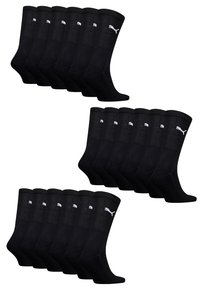 Schwarze Baumwollcrew-Socken mit gerippter Gestaltung, weißen Logoakzenten und glatter Textur. 12 Paar im Paket.