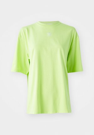 Lime green oversized T-shirt made of cotton, featuring a round neckline and short sleeves. Small white Adidas logo on the chest.