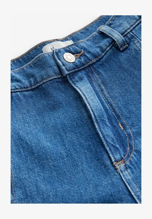 Faded keskmise sinise värviga teksapüksid, millel on nupplukuga ehtimine ja kontrastsete õmblustega. Kangas on sujuva tekstuuriga.