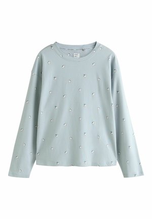 Vaaleansininen, ribbitekstuuriin tehty pitkähihainen paita, jossa on pieniä kukkakuvioita, pyöreä pääntie ja rento istuvuus. Pehmeä materiaali ja rennompi tyyli.