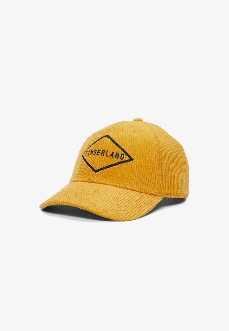 Žlutá kordurová kšiltovka s černým diamantovým logem a textem "TIMBERLAND." Má texturovanou tkaninu a zakřivený kšilt.