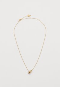 Collier en chaîne dorée avec un petit pendentif en forme d'étoile, orné de petites pierres transparentes, et une fermeture à clapet.