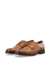 Chaussures habillées en cuir marron avec une finition lisse, un bout rond, un design traditionnel à lacets et un petit talon empilé.