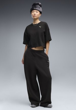 Puma, ESSENTIALS SLOUCHY PINTUCK OVERSIZED HOSE - Pantalon de survêtement - black
