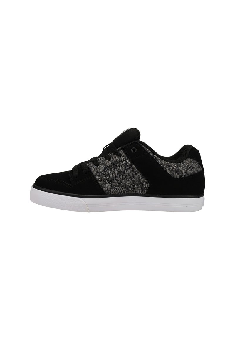 Must mustardad sneaker, mille ja mustriga tekstilikattega, valge kummist talla, ümmargused paelad ja pehme pahkluu toestus.