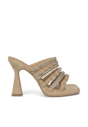 Beige high-heeled mules with a textured suede finish, featuring multiple horizontal straps adorned with small rhinestones.