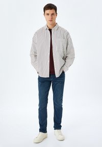 Koton BRAD - Vaqueros tapered - blue denim