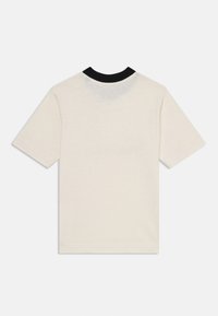 Cream short-sleeve t-shirt with a black ribbed collar, made of soft cotton; features a plain design with no visible logos or patterns.