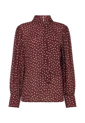 Bordeauxrote Bluse aus leichtem Stoff, mit Stehkragen, langen Ärmeln und einer Schleifendetail, durchgehend mit einem cremefarbenen Sternenmuster.