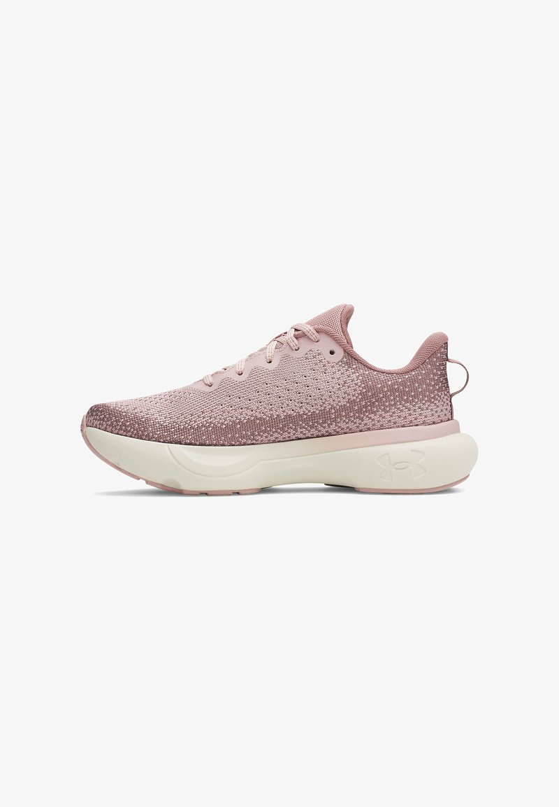 Light pink athletic shoes with a textured upper, lace-up design, and cream sole. Features a back pull tab and logo accent on the side.