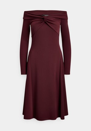 Burgundy off-the-shoulder dress with long sleeves, featuring a twisted bodice design and a flared skirt, made from a smooth, stretchy material.