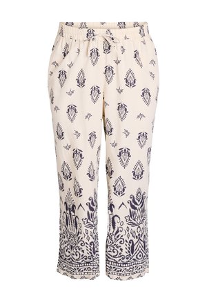 Cream colored pants with navy blue patterned design. Elastic waistband with drawstring, loose fit, cropped length, featuring intricate detailing.